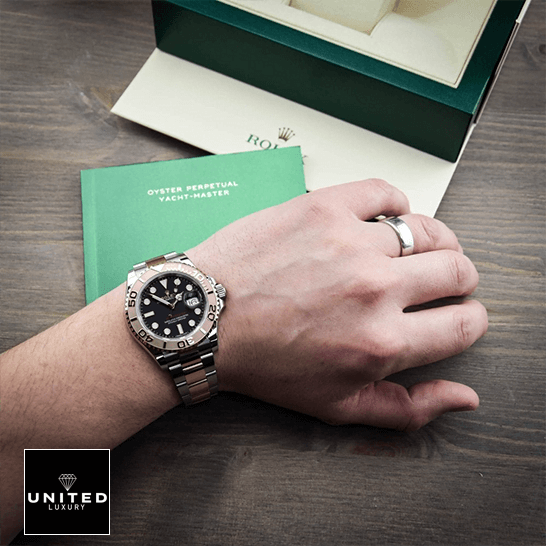 Rolex Yacht-Master 116621-0002 Collector’s Clone 1:1 rolex yacht master 116621 rose gold automatic brown dial replica man unitedluxurynet 1 Rolex Yatch Master 116621 Rose Gold Black Dial Replica warranty card next to